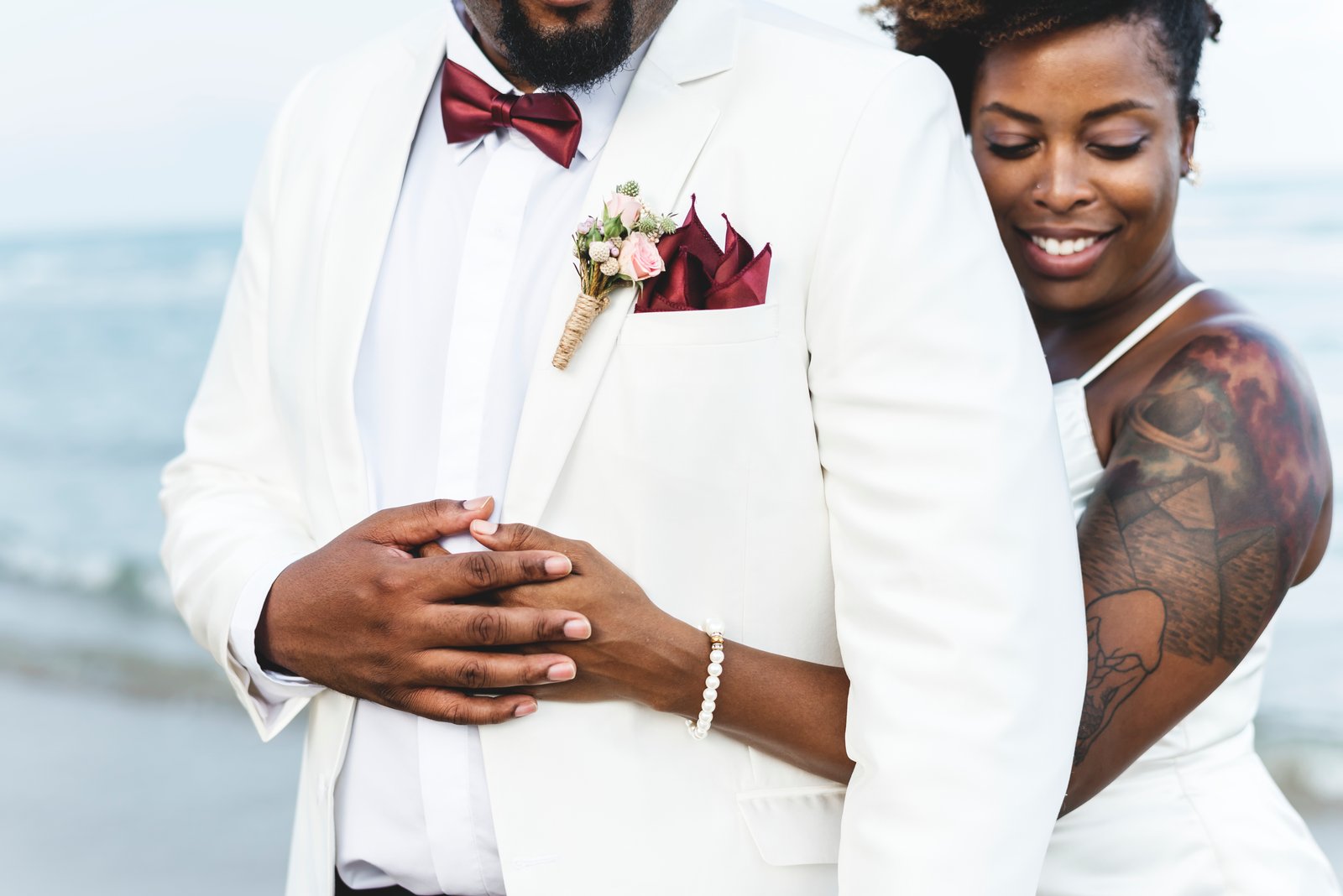 An Aurelia Grace hostess at a wedding reception in Buea, in white shirt and patterned bow tie.